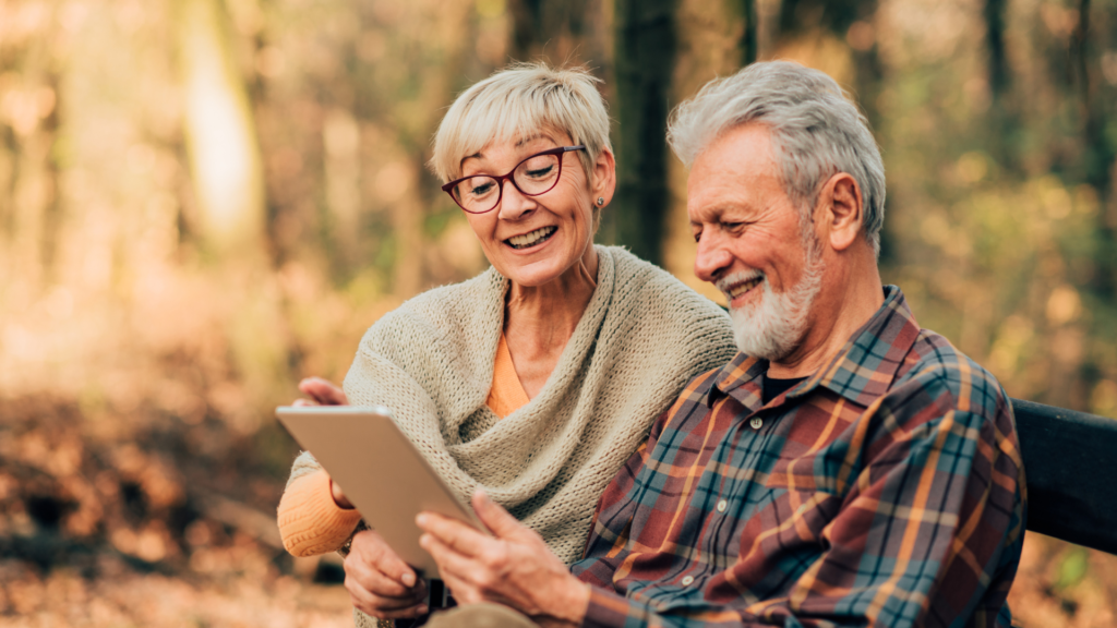 Seniors and Caregivers reading a book